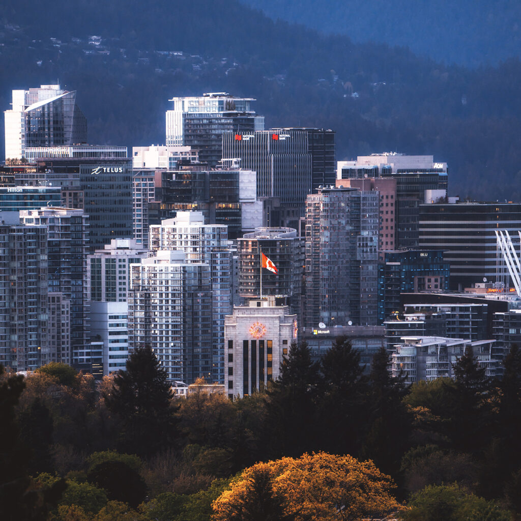 Vancouver skyline with City Hall at the center lined by trees