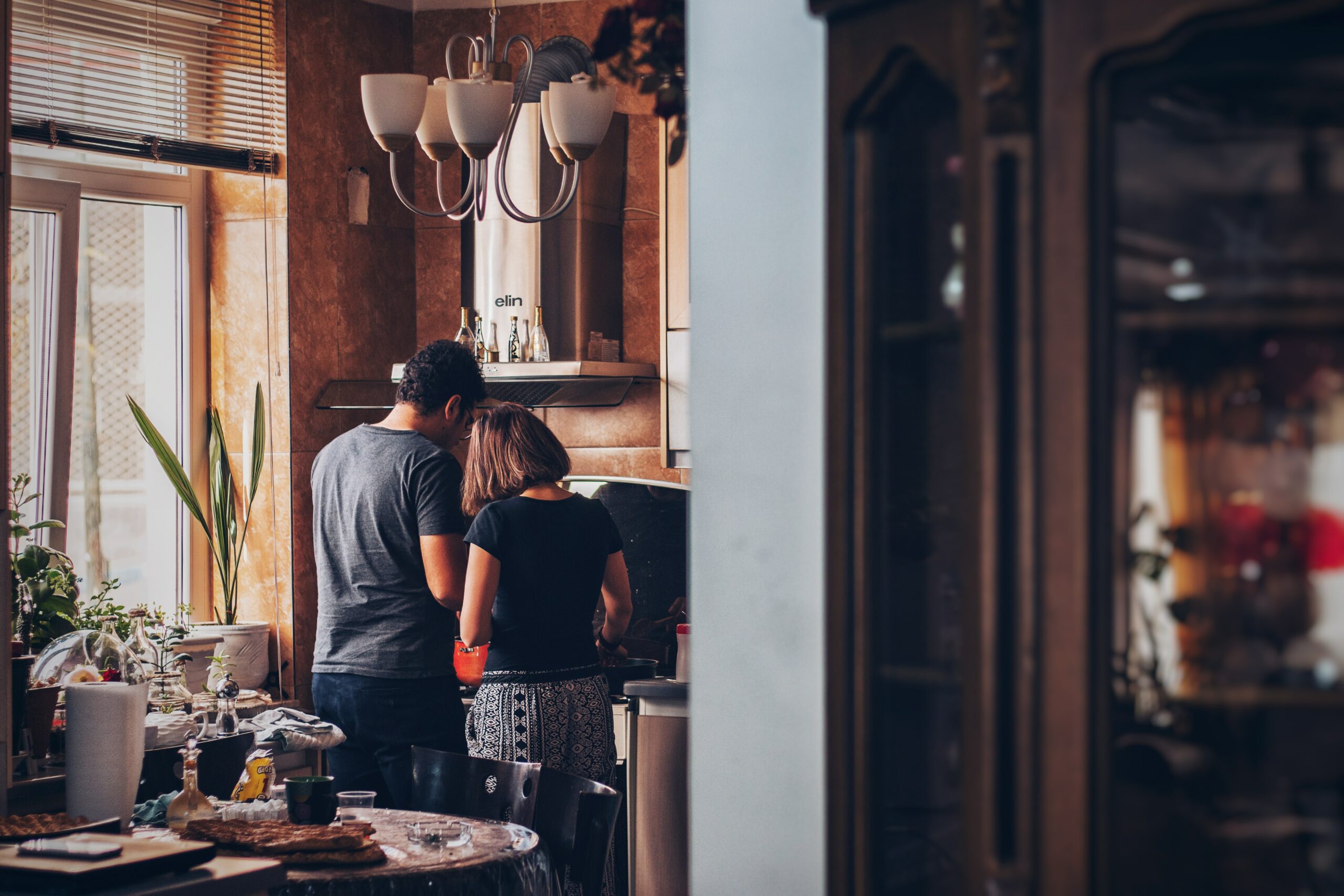 Couple cooking together in a stylish home